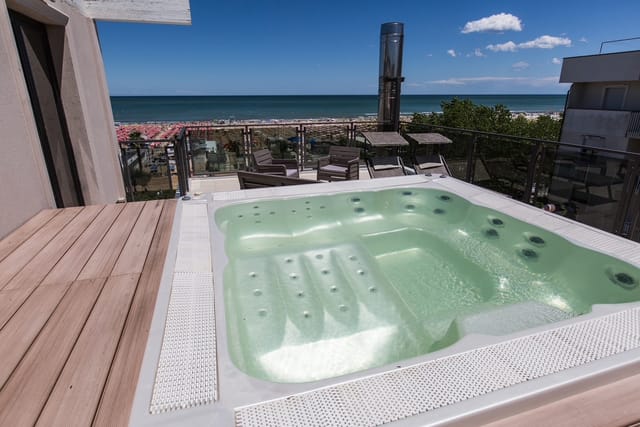 Hot tub on a terrace overlooking the beach